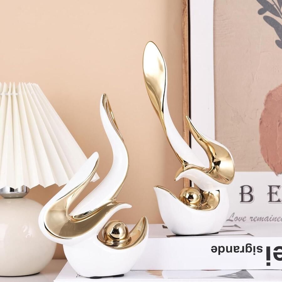 Abstract decoratief element in Mid-Century Modern stijl; porseleinen beelden voor de woonkamer tafelopzetstukken voor de eetkamer keramische sculpturen en gouden sieraden (witgoud)