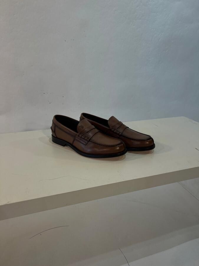 Tod's mocassins bruin in gepatineerd leer met zadelriempje voor heren