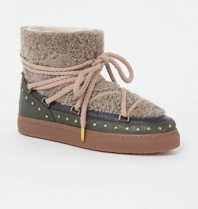 Inuikii Snowboot van schapenwol met leren details Schoenen.nl