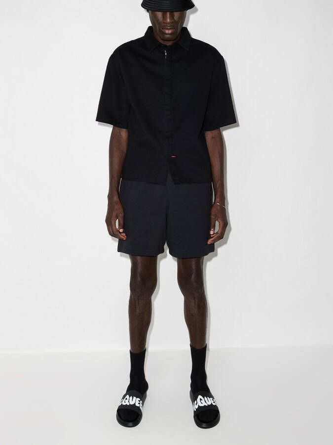 Alexander McQueen Slippers met logo Zwart
