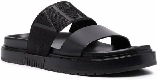 Valentino Garavani Slippers met logo reliëf Zwart