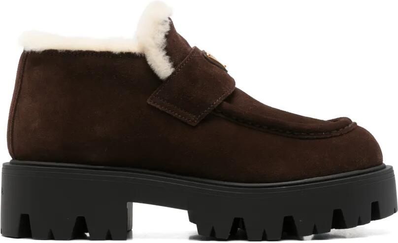 Prada Stride enkellaarzen met lammy afwerking Bruin