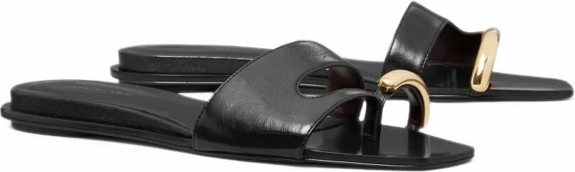Tory Burch Pierced leather slides Zwart