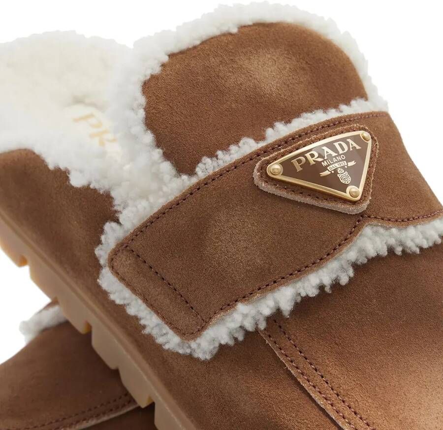 Prada Slippers & Mules Shearling Trim Suede Mules in bruin