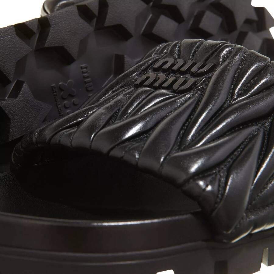 Miu Slippers Slides in zwart