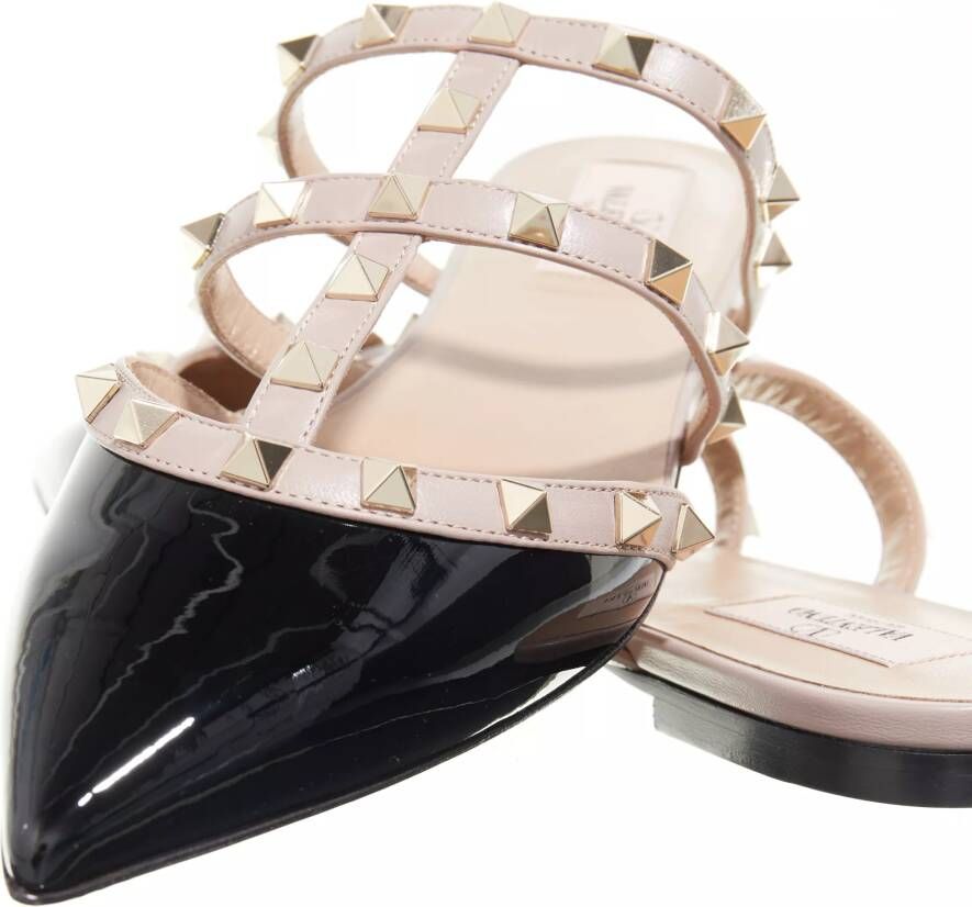 Valentino Garavani Slippers Rockstud Flat Mules in poeder roze