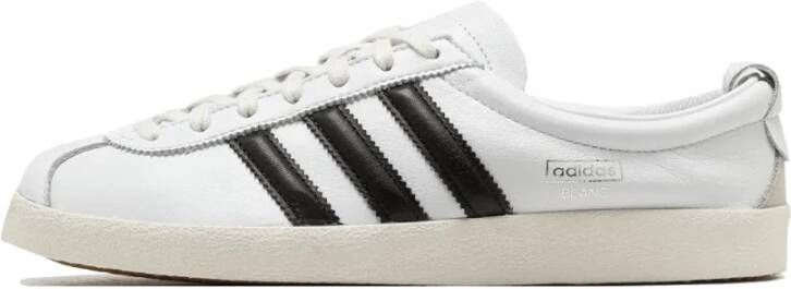 Adidas Klassieke witte sneakers met zwarte strepen
