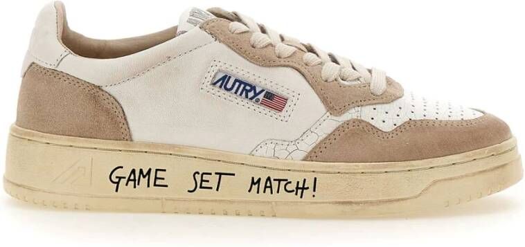 Autry Witte leren sneakers met geperforeerde neus en gewatteerde enkel Wit Dames