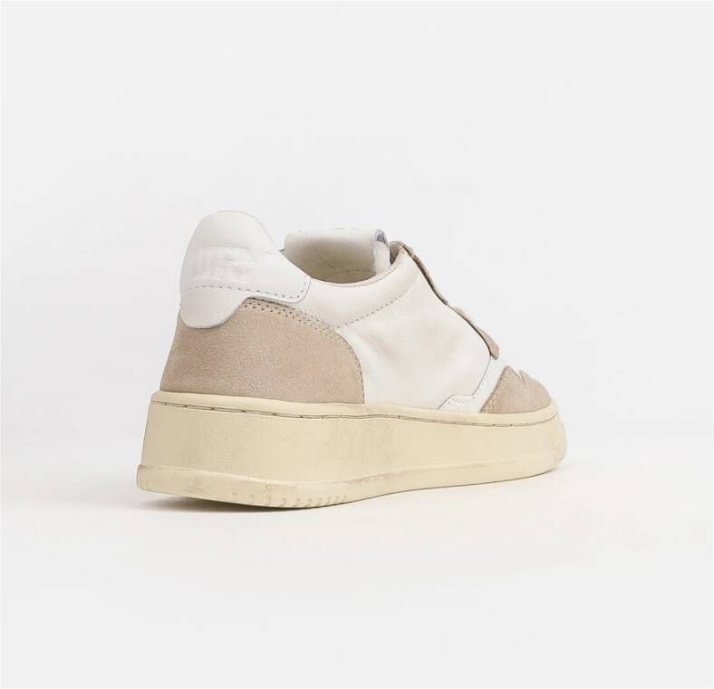 Autry Witte leren sneakers met geperforeerde neus en gewatteerde enkel Wit Dames