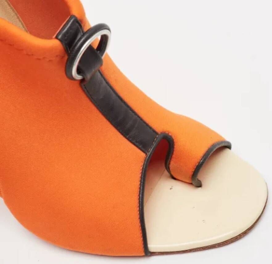 Christian Louboutin Pre-owned Fabric heels Orange Dames