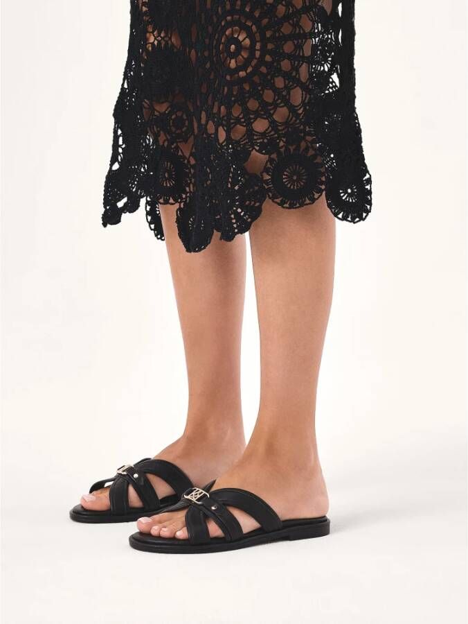 Kazar Leren slippers op platte zool met monogram