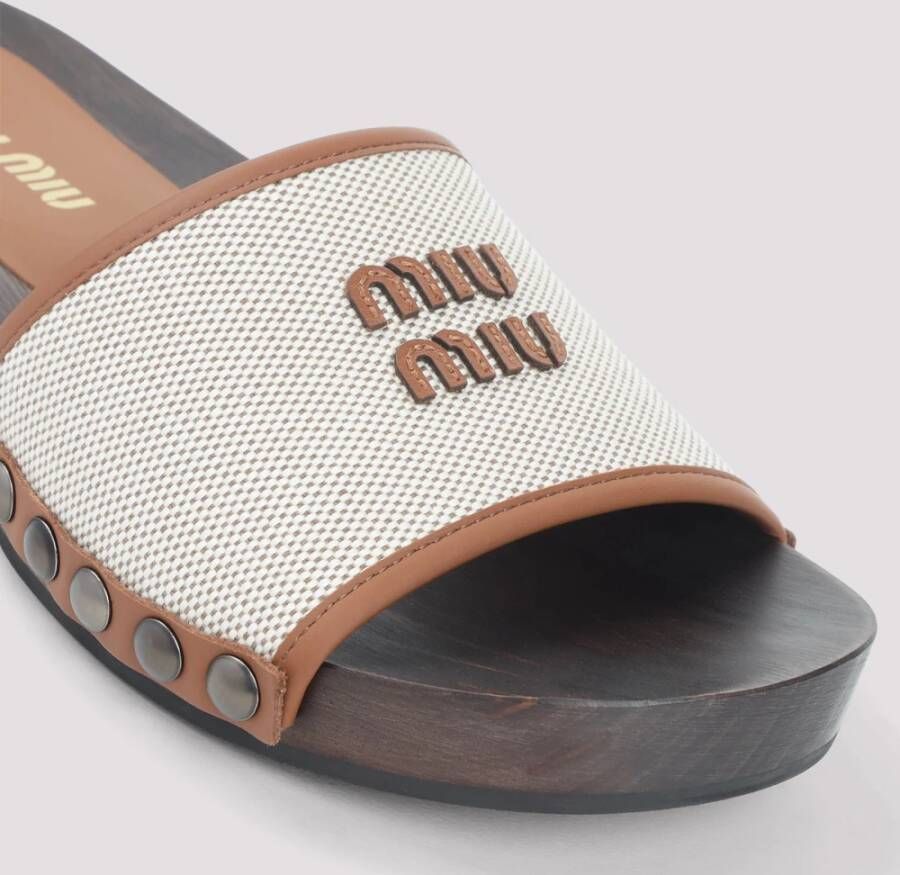 Miu Canvas en leren klompen met logo