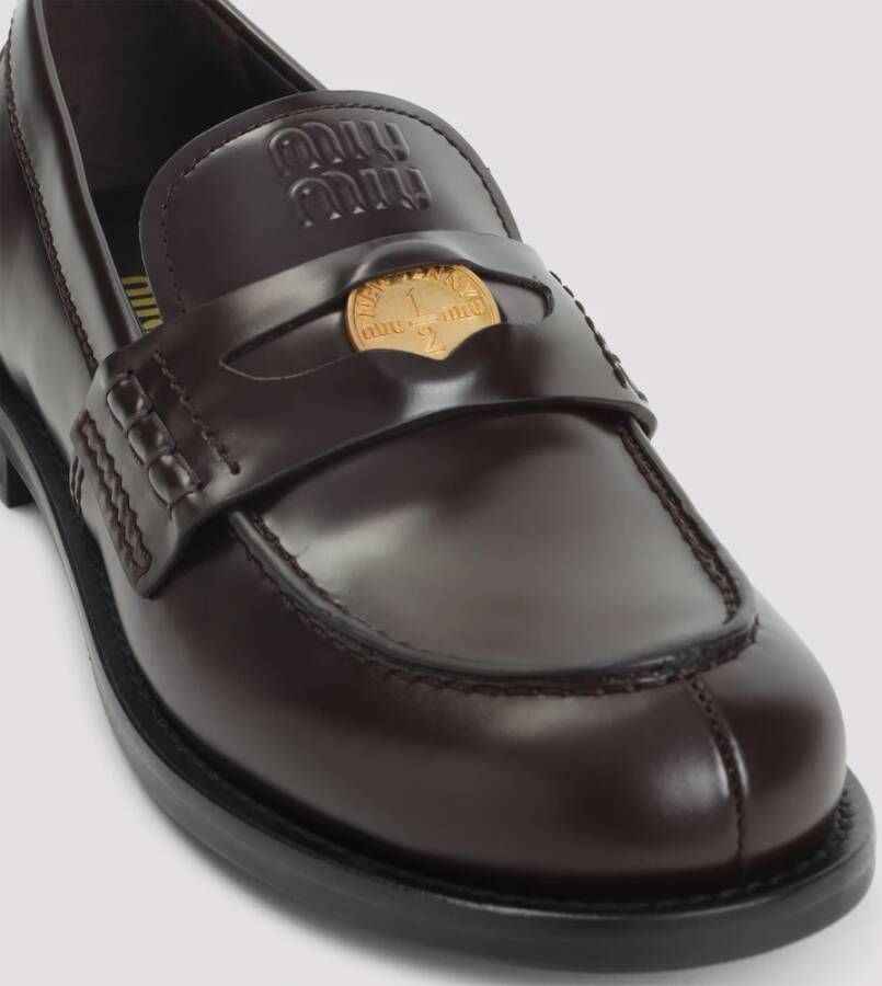 Miu Leren Loafers met Metalen Plaque