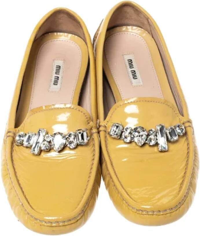 Miu Pre-owned Leather flats Yellow Dames