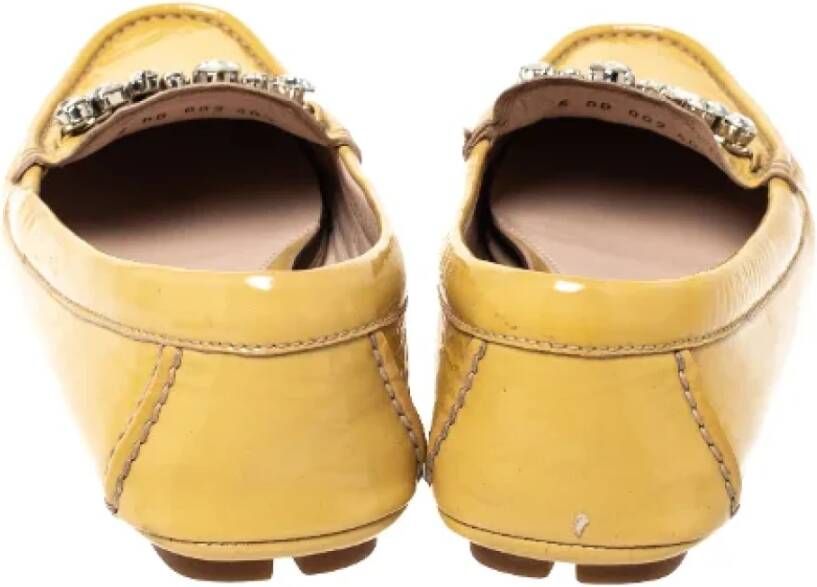 Miu Pre-owned Leather flats Yellow Dames