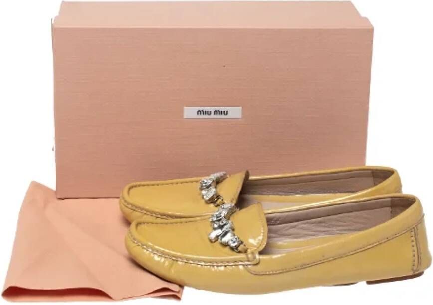 Miu Pre-owned Leather flats Yellow Dames