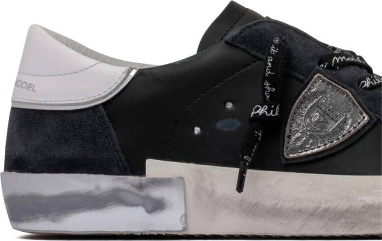 Philippe Model Zwarte en witte sneakers van verouderd leer