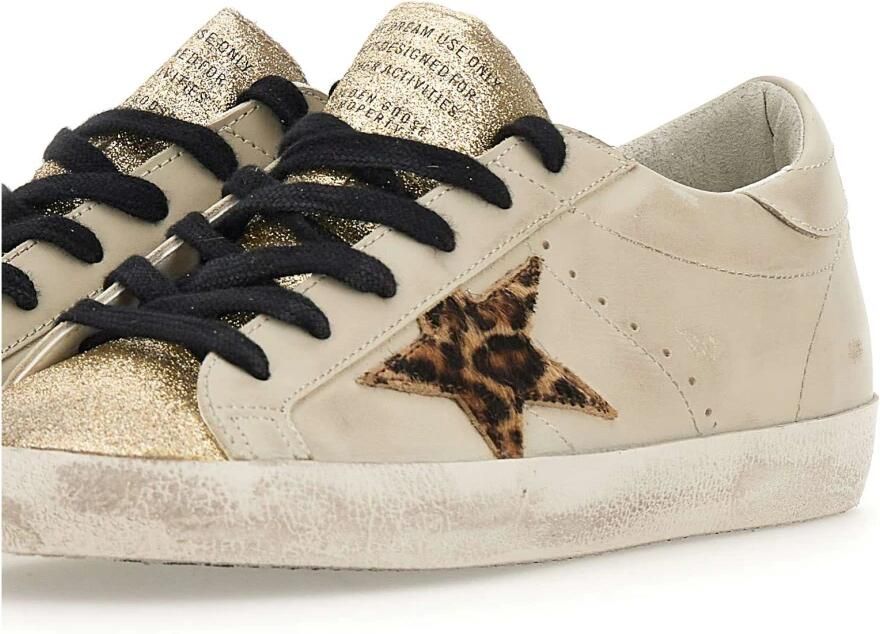 Golden Goose Low-Top Sneakers Gold Glitter Sneakers With Pony Hair Star Accent in goud