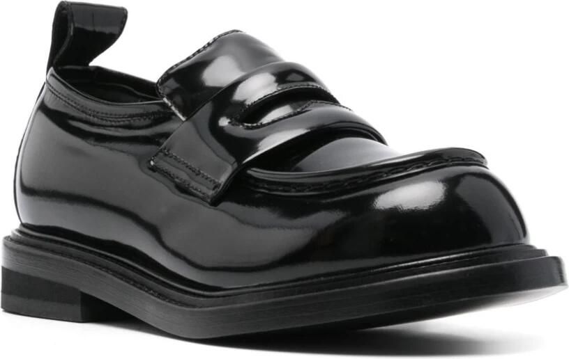 Moschino Zwarte leren platte schoenen