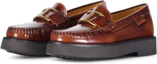 Tod's Glanzende leren loafers met gouden logo