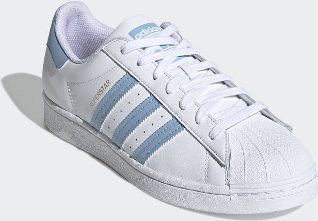 Hoeveelheid van Giet klem Adidas Originals Superstar sneakers wit lichtblauw - Schoenen.nl