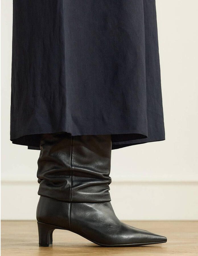 Manfield Dames Zwarte leren slouchy enkellaarsjes met hak